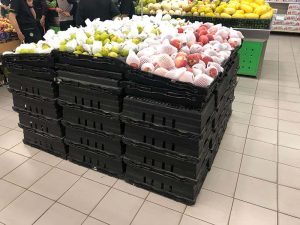 bale arms crates in supermarket for fruit display